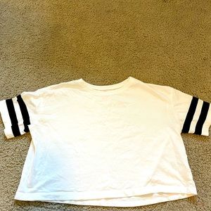 Two H&M plain tops with striped sleeves.
